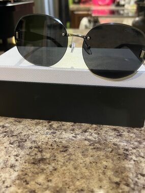CHANEL Rimless Round Sunglasses in Black and Gold